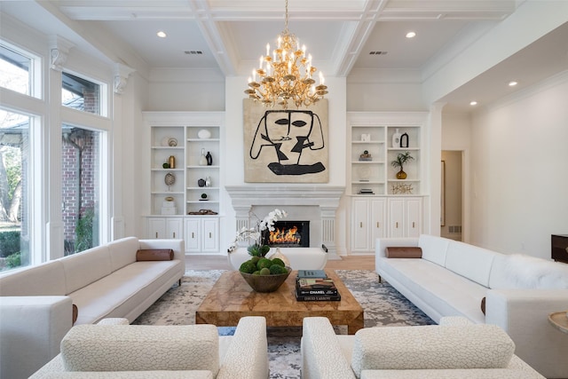 living room with coffered ceiling, beam ceiling, light wood-type flooring, a notable chandelier, and a fireplace