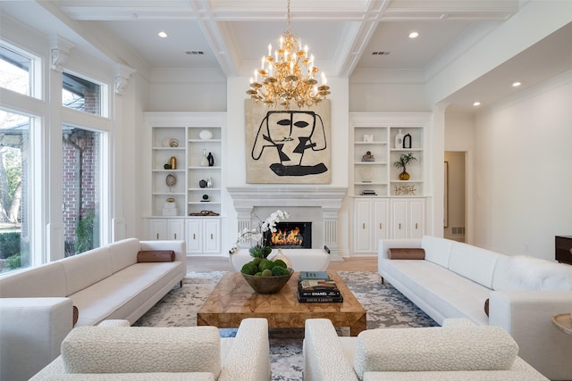 2 Manzano, Dallas, TX 75230 - living area with a chandelier, a lit fireplace, beamed ceiling, light wood finished floors, and coffered ceiling
