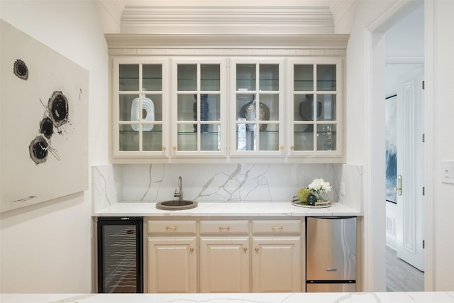 2 Manzano, Dallas, TX 75230 - indoor wet bar featuring wine cooler, crown molding, and backsplash