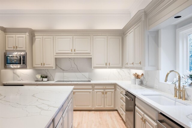 bar featuring stainless steel refrigerator, wine cooler, sink, backsplash, and crown molding