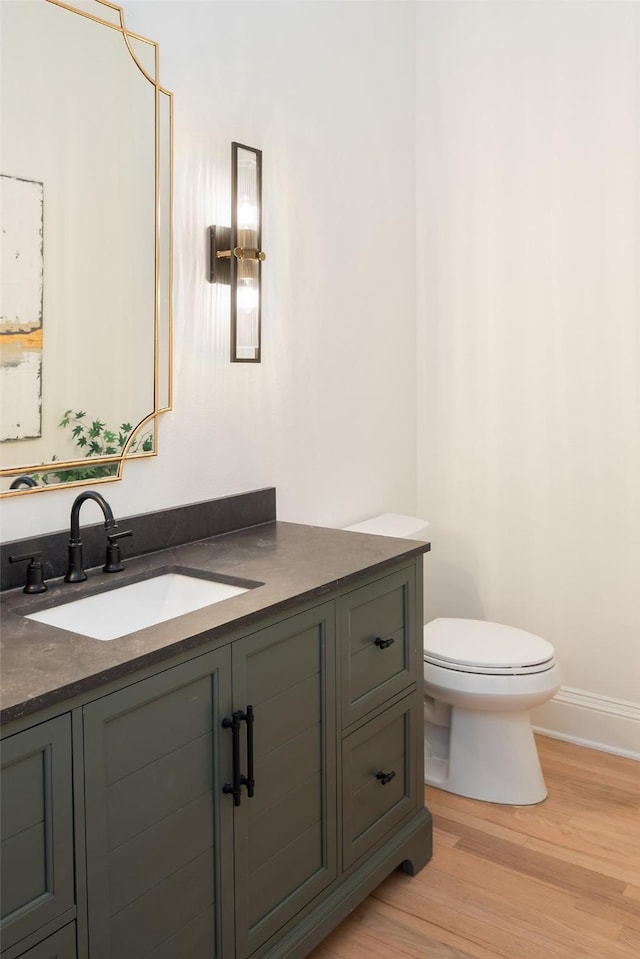 2 Manzano, Dallas, TX 75230 - bathroom featuring vanity, wood finished floors, toilet, and baseboards