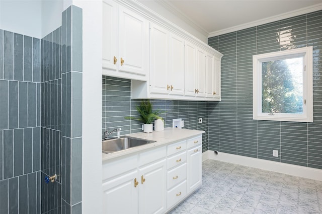 2 Manzano, Dallas, TX 75230 - kitchen with a sink, crown molding, white cabinets, light flooring, and baseboards