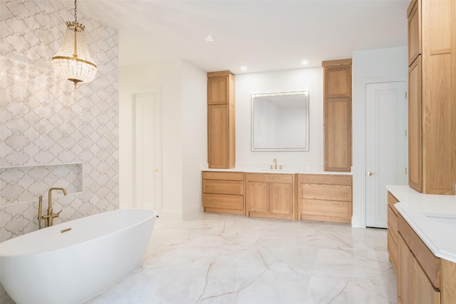 bathroom featuring vanity and a tub to relax in