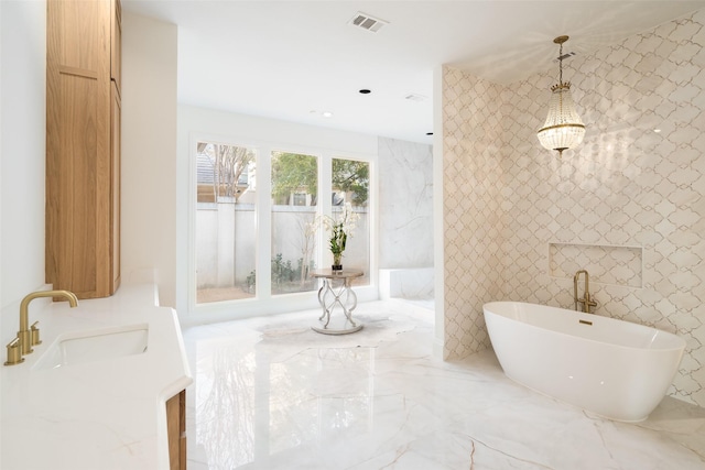 bathroom with vanity and a bathing tub