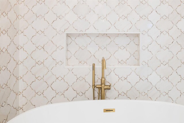 bathroom with tiled shower