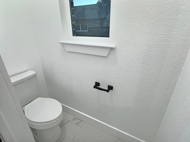 bathroom featuring toilet