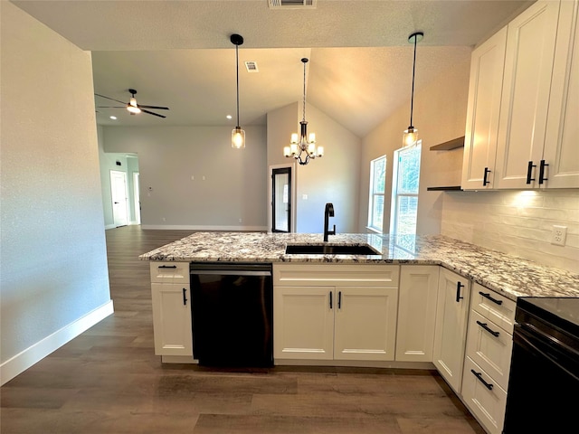 kitchen featuring dark hardwood / wood-style floors, white cabinets, black appliances, and vaulted ceiling