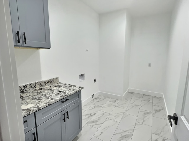 laundry room with cabinets, washer hookup, and hookup for an electric dryer