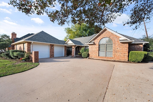 single story home featuring a garage