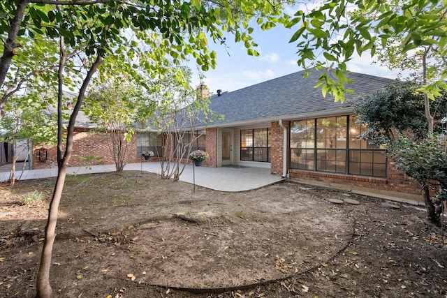 5400 Emerald Park Blvd, Arlington, TX 76017 - back of house with roof with shingles, brick siding, and a patio area