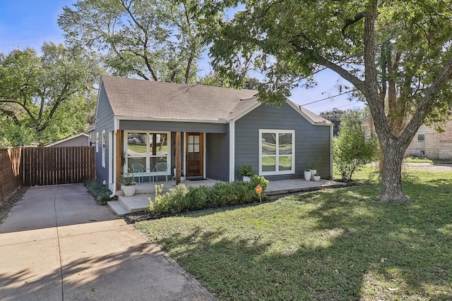 view of front of house with a porch and a front lawn