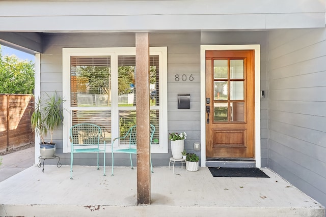 doorway to property with covered porch