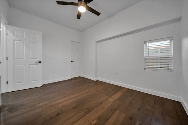 spare room with ceiling fan and dark hardwood / wood-style floors