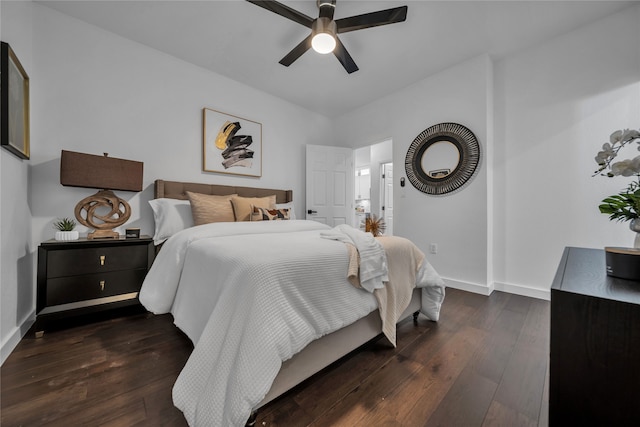 bedroom with ceiling fan, dark hardwood / wood-style flooring, and vaulted ceiling