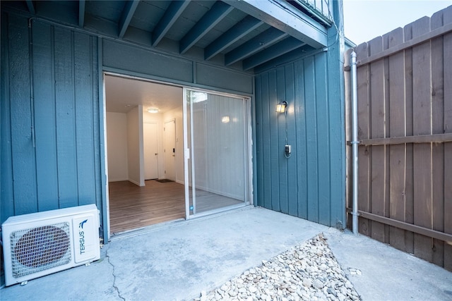 doorway to property with ac unit