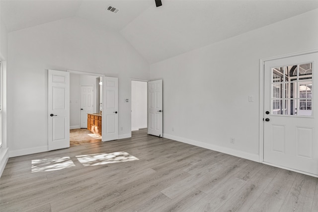 unfurnished bedroom with ceiling fan, high vaulted ceiling, and light hardwood / wood-style flooring