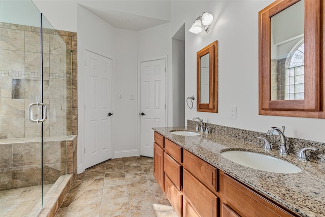 bathroom featuring vanity and a shower with shower door