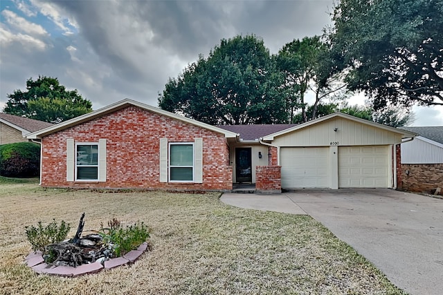 single story home with a front yard and a garage