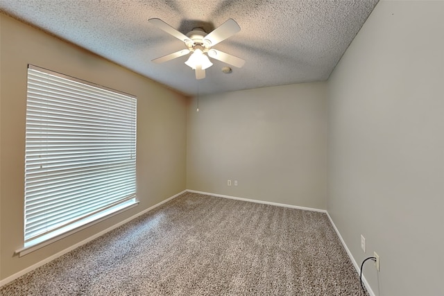 unfurnished room with carpet flooring, ceiling fan, and a textured ceiling