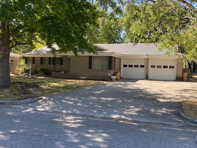 ranch-style home featuring a garage