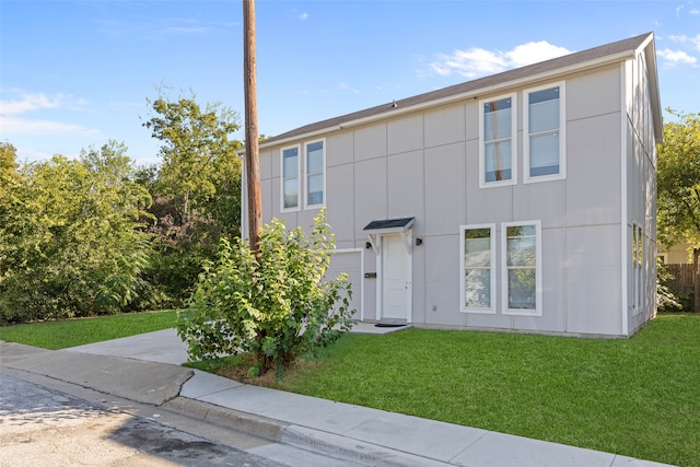 view of front of home with a front lawn