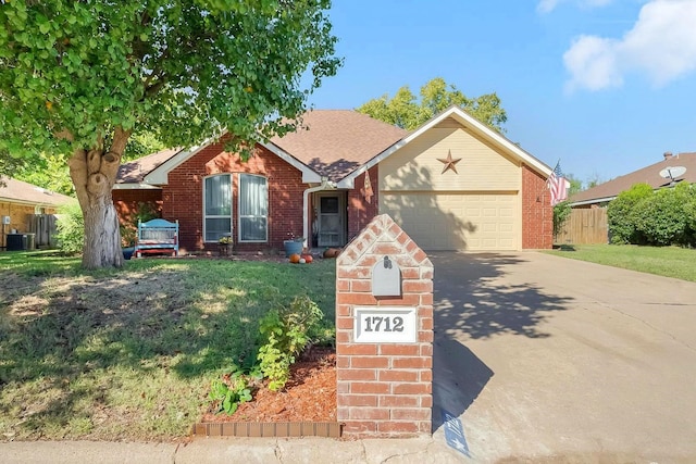 ranch-style house with a front lawn, a garage, and cooling unit