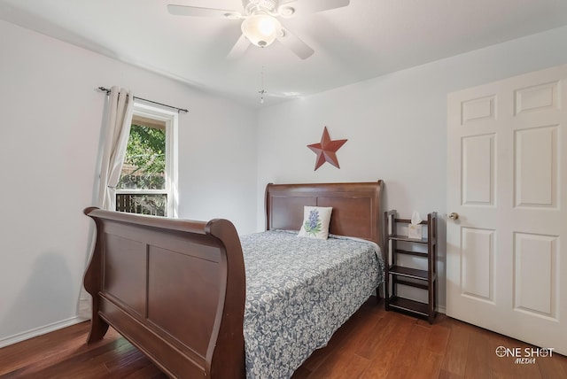 bedroom with dark hardwood / wood-style floors and ceiling fan