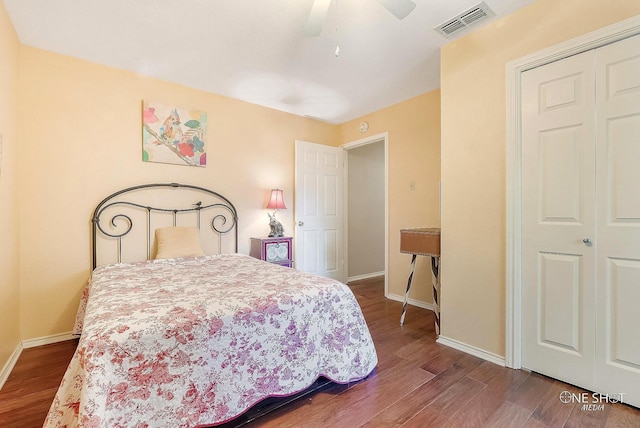 bedroom with ceiling fan, a closet, and hardwood / wood-style flooring