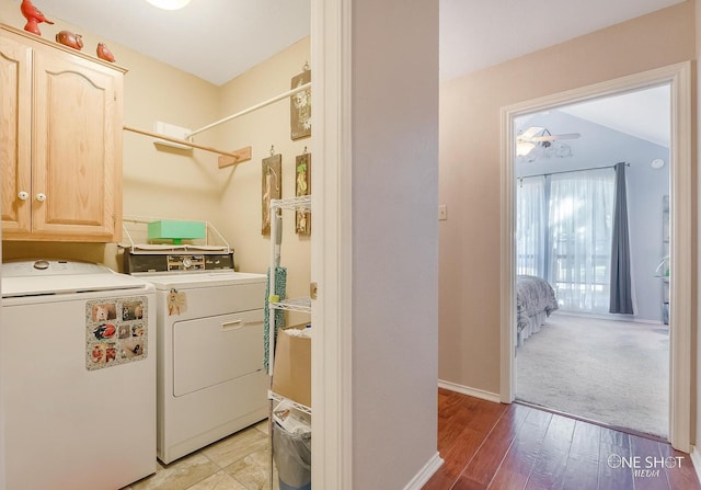 laundry room with separate washer and dryer, cabinets, ceiling fan, and light hardwood / wood-style floors