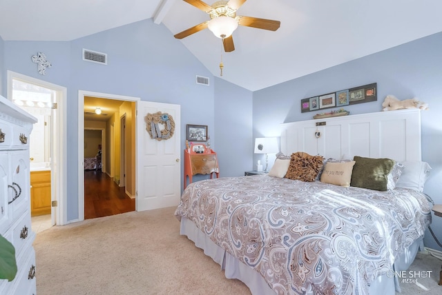 carpeted bedroom with high vaulted ceiling, ensuite bathroom, beam ceiling, and ceiling fan