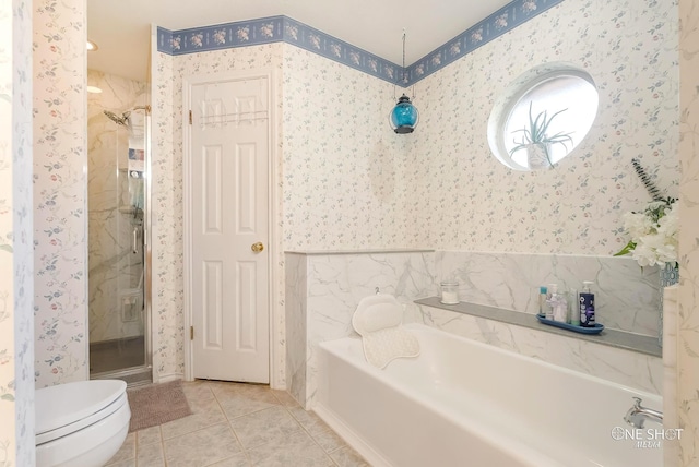 bathroom with separate shower and tub, tile patterned floors, and toilet