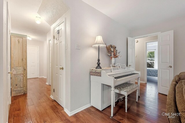 hall featuring wood-type flooring