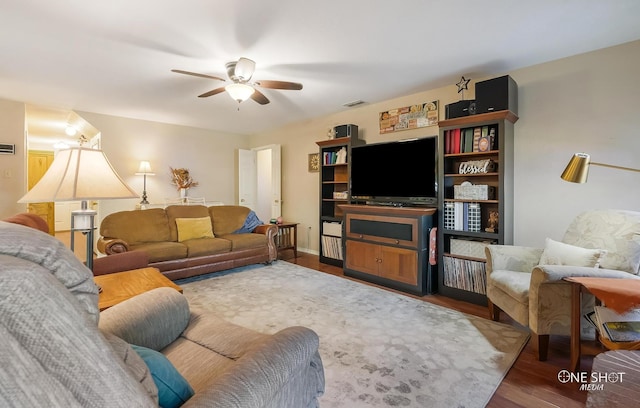 living room with ceiling fan and hardwood / wood-style flooring