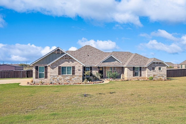 craftsman-style home featuring a front yard