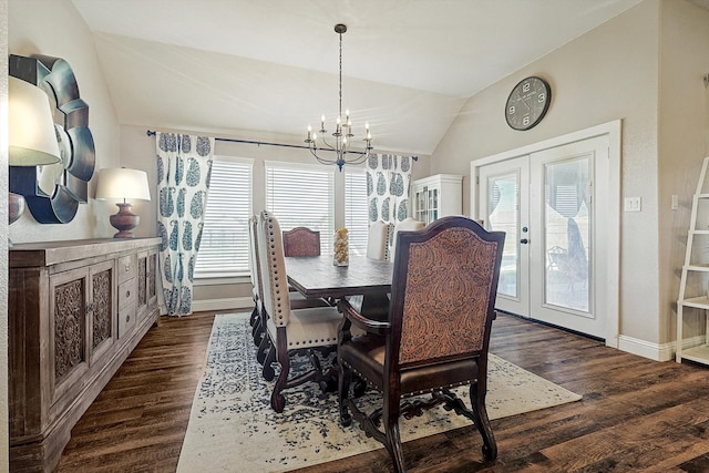 dining area featuring french doors, dark hardwood / wood-style flooring, a chandelier, and vaulted ceiling