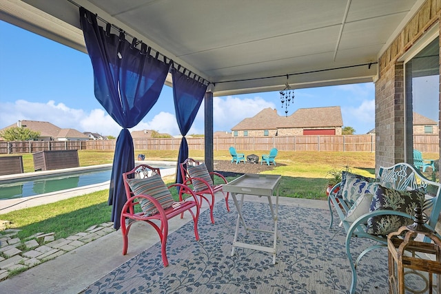 view of patio with a fenced in pool