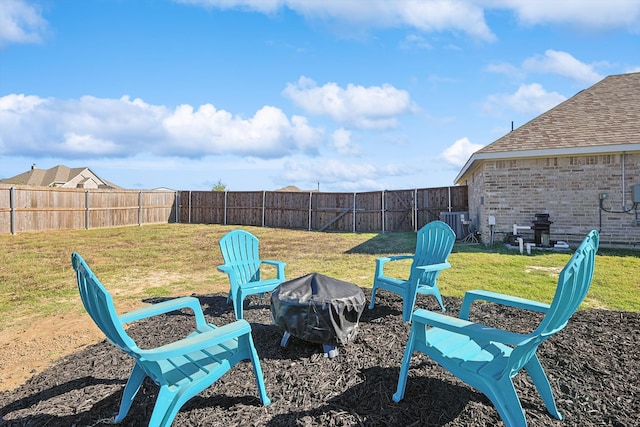 view of yard with a fire pit