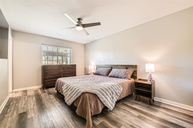 bedroom featuring ceiling fan and dark hardwood / wood-style floors