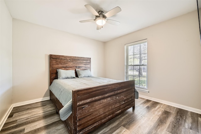 bedroom with ceiling fan and dark hardwood / wood-style flooring