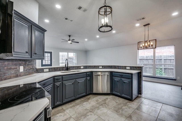 kitchen with pendant lighting, sink, gray cabinetry, light stone countertops, and stainless steel dishwasher