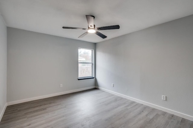 unfurnished room with ceiling fan and light hardwood / wood-style floors