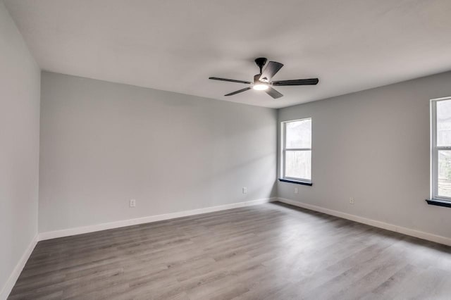 spare room featuring ceiling fan and hardwood / wood-style floors