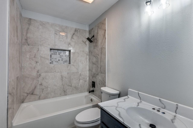 full bathroom with tiled shower / bath combo, vanity, and toilet