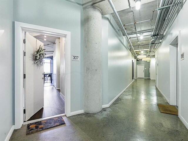 hall with dark wood-type flooring