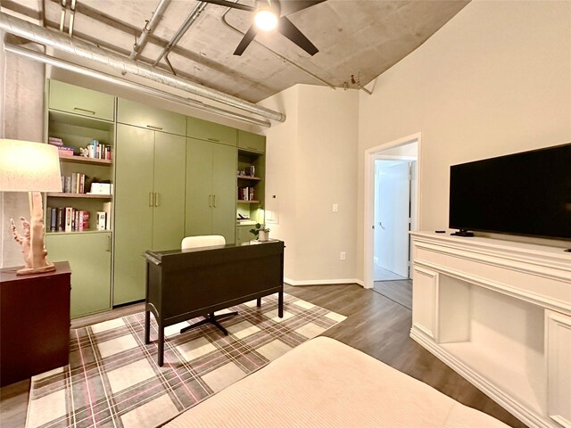 bedroom featuring dark wood-type flooring and a closet