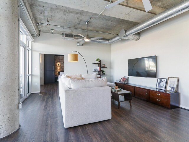 living room featuring dark hardwood / wood-style floors and ceiling fan