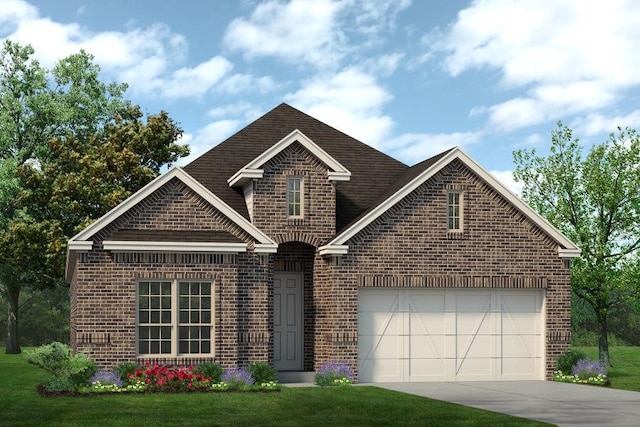 view of front facade with a garage and a front lawn