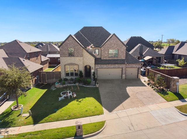 view of front facade with a garage and a front lawn