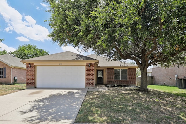 ranch-style home with a garage and cooling unit