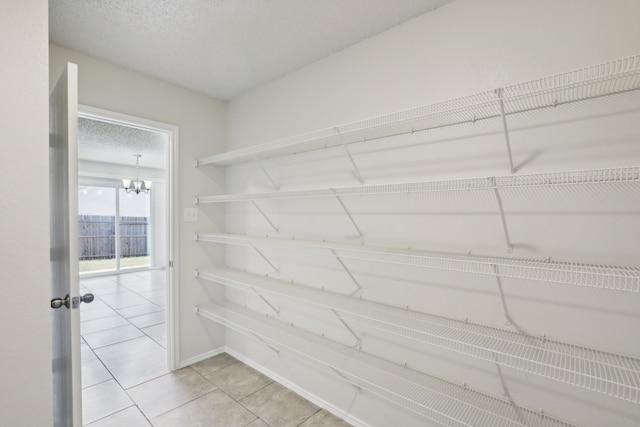 spacious closet with tile patterned flooring